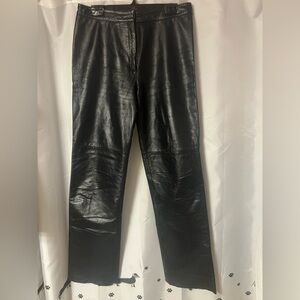Danier Black Leather pant. Zipper front. No pockets for flat fit. Size 10. NWOT